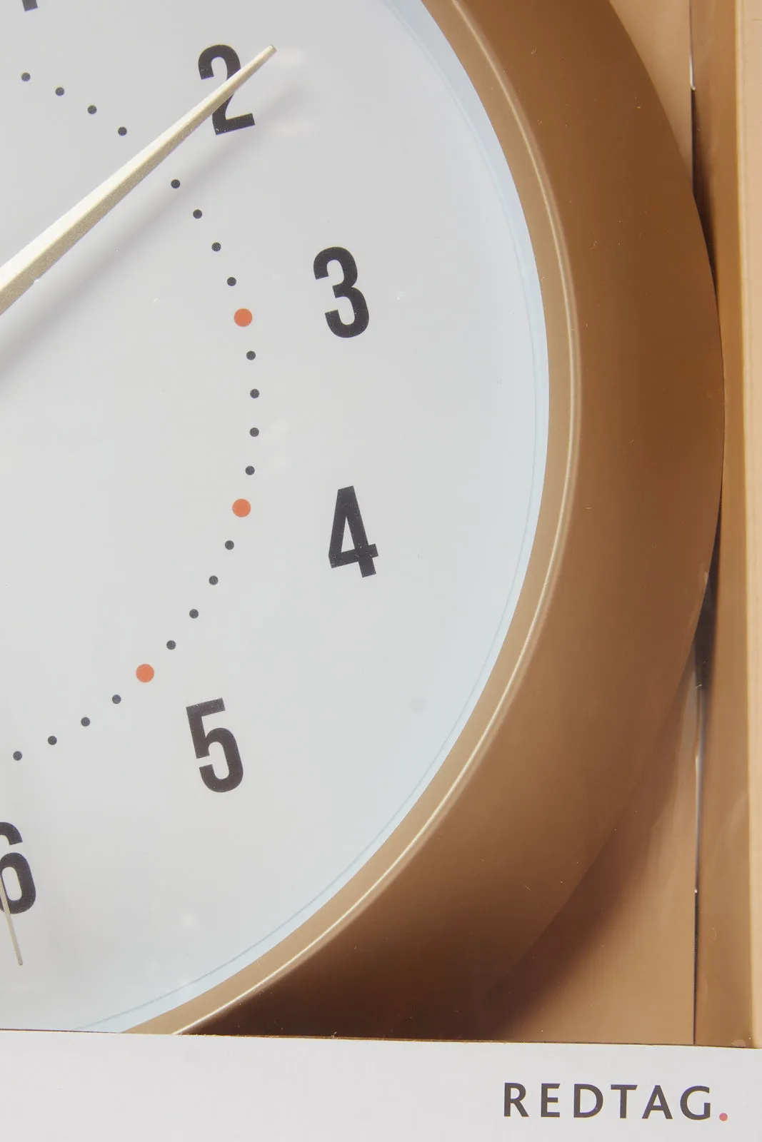 Brown And White Wall Clock With Numbers And Plain Frame