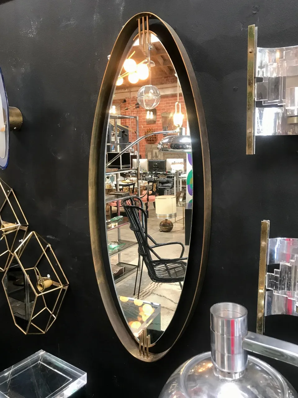 Oval Wall Mirror with Iron Floating and Brass Style Frame. Italy, 1970s